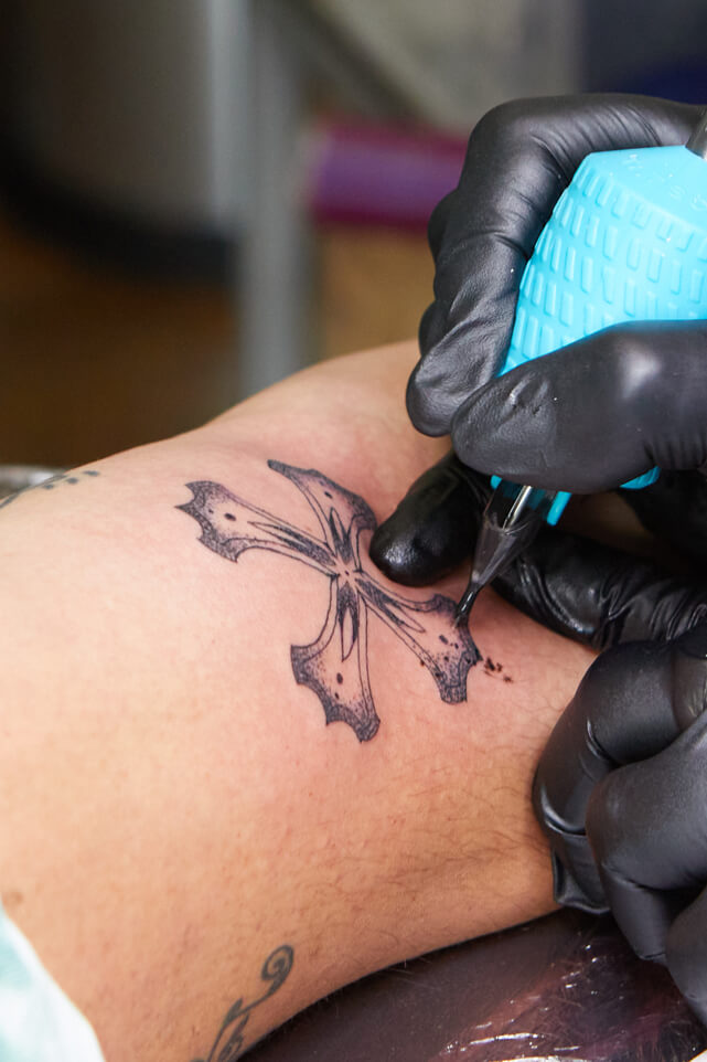 A tattoo inspired by Bumbu's logo received at a pop up event